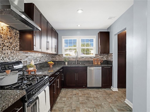 10404 Gaviota Ave, Granada Hills, CA 91344 - kitchen with gas range, wall chimney exhaust hood, dishwasher, backsplash, and dark stone counters