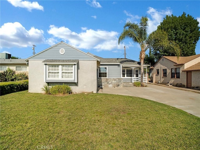 10404 Gaviota Ave, Granada Hills, CA 91344 - single story home with a front lawn, stone siding, and stucco siding