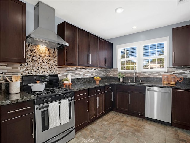 10404 Gaviota Ave, Granada Hills, CA 91344 - kitchen with stainless steel appliances, wall chimney exhaust hood, backsplash, dark stone counters, and dark brown cabinets