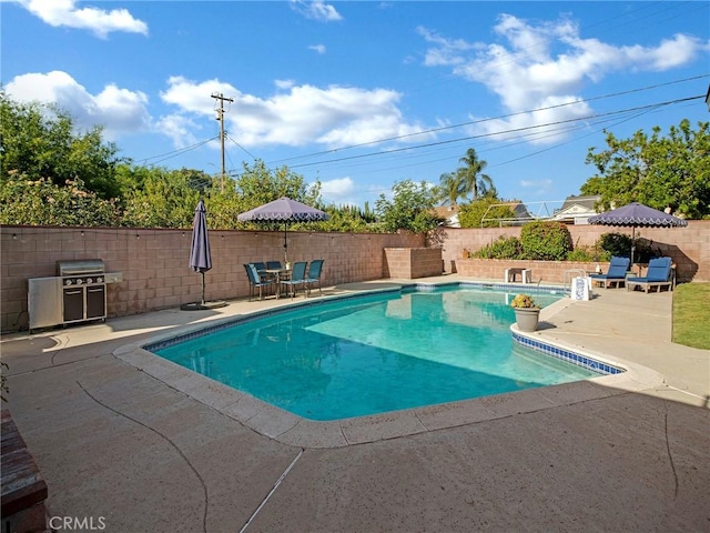 10404 Gaviota Ave, Granada Hills, CA 91344 - view of swimming pool featuring a patio, a fenced backyard, and a grill