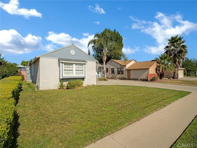 10404 Gaviota Ave, Granada Hills, CA 91344 - single story home with driveway, a front lawn, and stucco siding