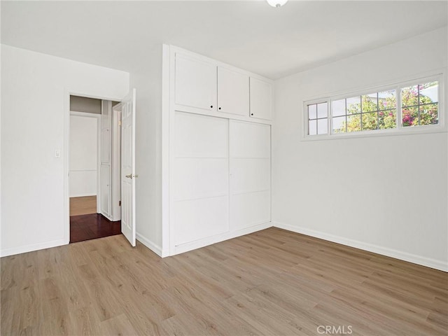 10404 Gaviota Ave, Granada Hills, CA 91344 - unfurnished bedroom with light wood-type flooring and a closet