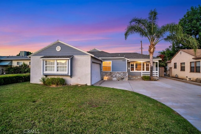 10404 Gaviota Ave, Granada Hills, CA 91344 - ranch-style house featuring an attached garage, driveway, a front lawn, stone siding, and covered porch