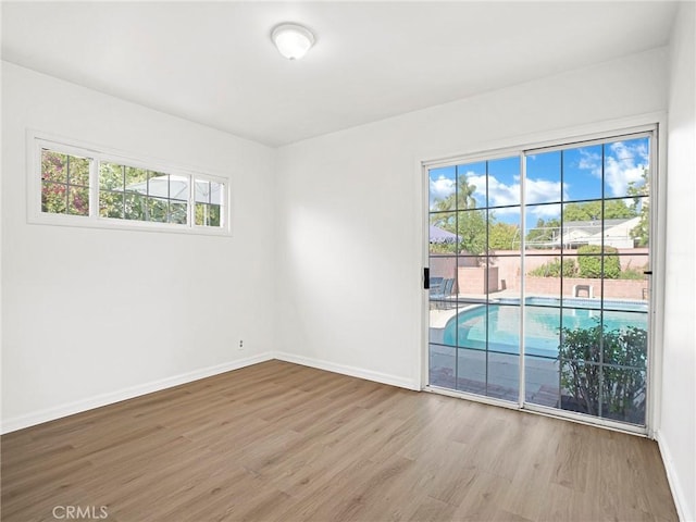 10404 Gaviota Ave, Granada Hills, CA 91344 - unfurnished room with wood finished floors and baseboards