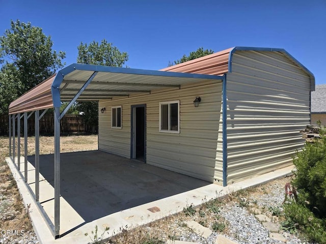 12780 Fir St, Oak Hills, CA 92344 - view of outdoor structure with a carport