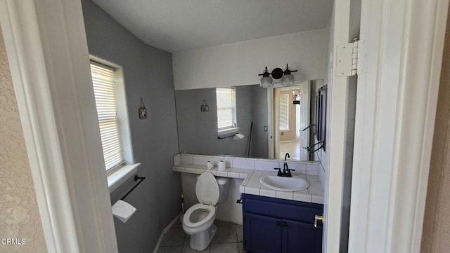 12780 Fir St, Oak Hills, CA 92344 - bathroom featuring toilet, vanity, and tile patterned flooring
