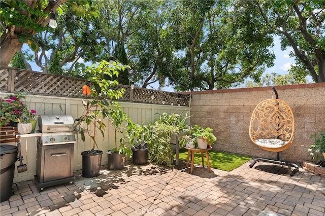 2342 Aspen St, Tustin, CA 92782 - fenced backyard featuring grilling area and a patio