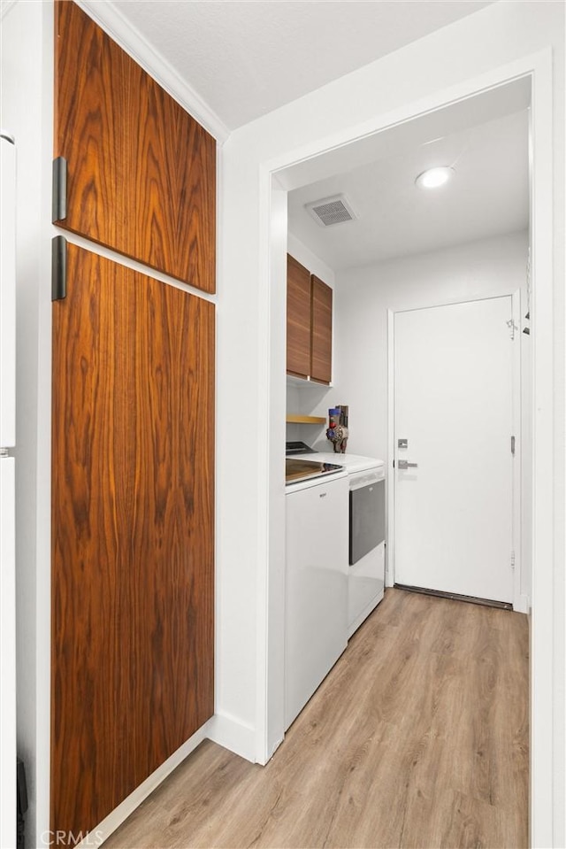 2342 Aspen St, Tustin, CA 92782 - laundry area with washer and dryer, light wood-style flooring, cabinet space, and recessed lighting