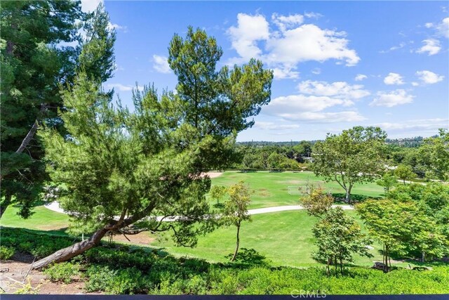 25541 Indian Hill Ln Unit P, Laguna Hills, CA 92653 - surrounding community with view of golf course and a yard
