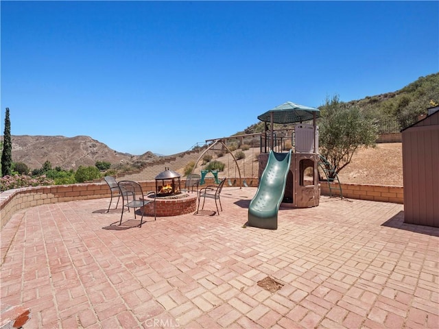 15242 Poppy Meadow St, Canyon Country, CA 91387 - view of patio with a playground and a mountain view