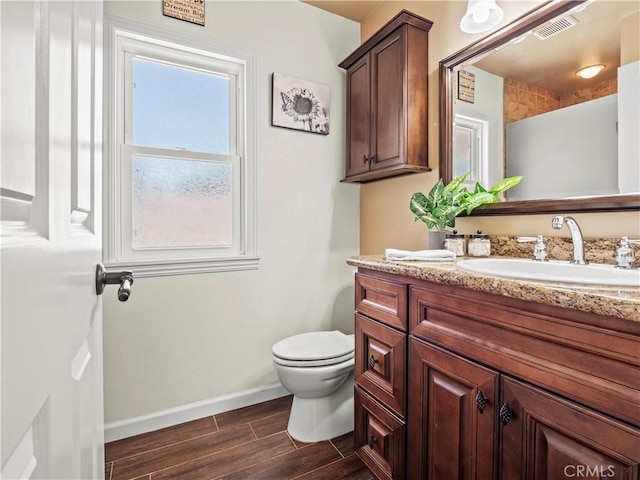 15242 Poppy Meadow St, Canyon Country, CA 91387 - bathroom with vanity, wood tiled floors, toilet, and baseboards
