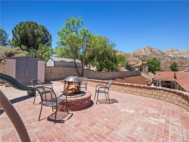 15242 Poppy Meadow St, Canyon Country, CA 91387 - view of patio with a fire pit and a mountain view