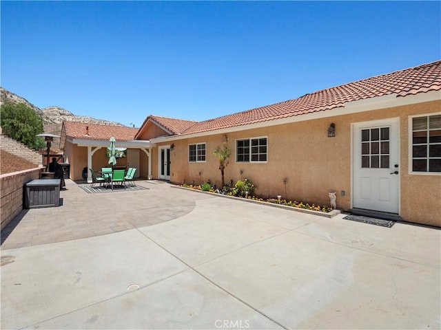 15242 Poppy Meadow St, Canyon Country, CA 91387 - back of property featuring stucco siding and a tiled roof
