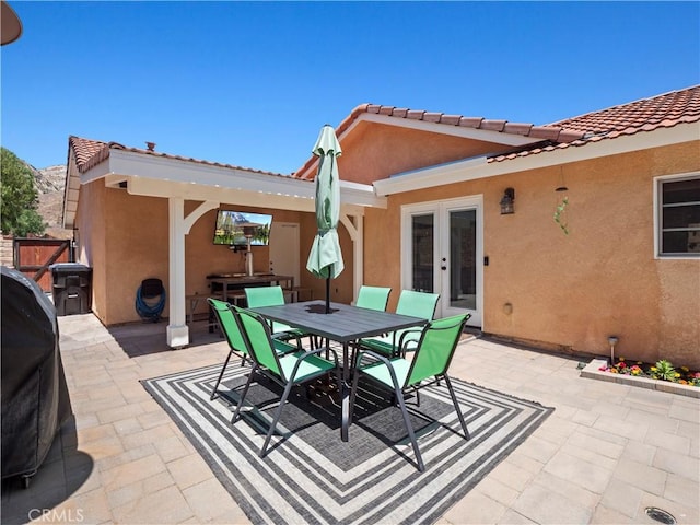 15242 Poppy Meadow St, Canyon Country, CA 91387 - view of patio featuring french doors and outdoor dining space