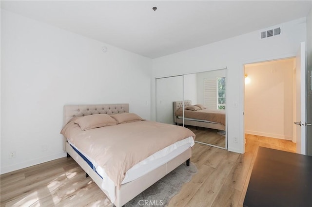 585 N Rossmore Ave Unit 209, Los Angeles, CA 90004 - bedroom with light wood-type flooring, a closet, and baseboards