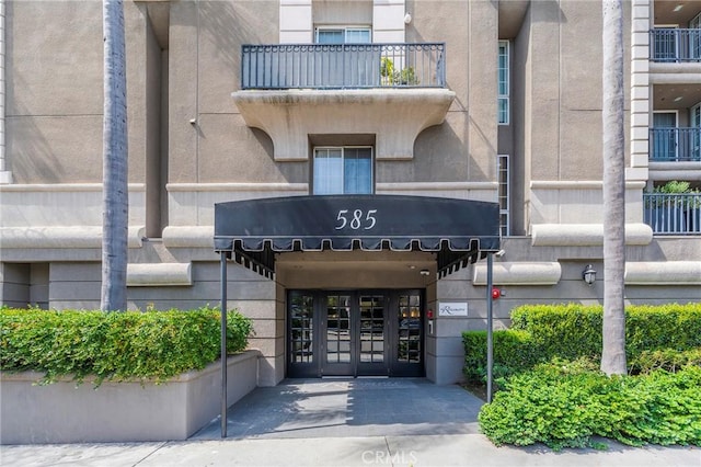 585 N Rossmore Ave Unit 209, Los Angeles, CA 90004 - doorway to property with stucco siding