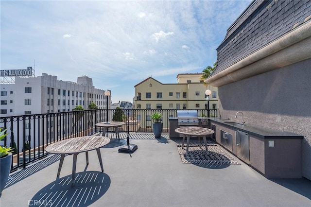 585 N Rossmore Ave Unit 209, Los Angeles, CA 90004 - view of patio with a sink and a balcony