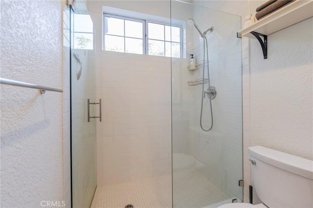 585 N Rossmore Ave Unit 209, Los Angeles, CA 90004 - full bathroom featuring toilet, a shower stall, and a textured wall