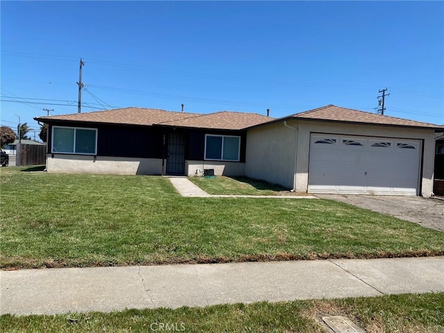 1017 W Prune Ave, Lompoc, CA 93436 - ranch-style home featuring an attached garage, a front lawn, stucco siding, asphalt driveway, and roof with shingles