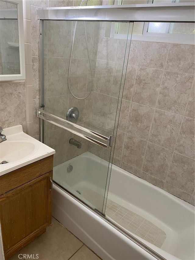 1017 W Prune Ave, Lompoc, CA 93436 - bathroom featuring bath / shower combo with glass door, vanity, and tile patterned floors