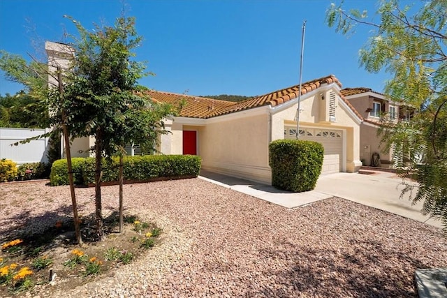 36364 Provence Dr, Murrieta, CA 92562 - mediterranean / spanish house featuring an attached garage, stucco siding, driveway, and a tiled roof