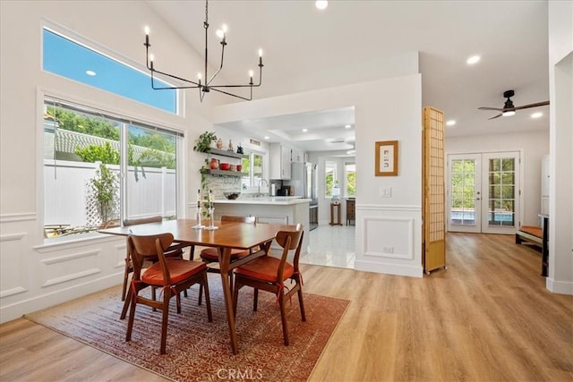 36364 Provence Dr, Murrieta, CA 92562 - dining area featuring a decorative wall, light wood-type flooring, a chandelier, recessed lighting, and wainscoting