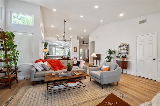 36364 Provence Dr, Murrieta, CA 92562 - living room with high vaulted ceiling, light wood-type flooring, healthy amount of natural light, and recessed lighting