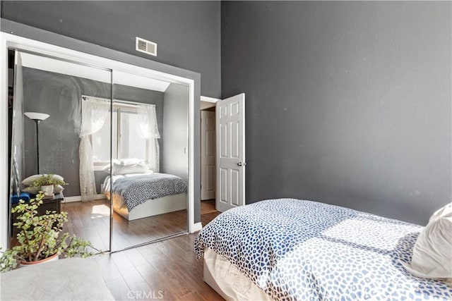 12531 Cluster Pines Rd, Garden Grove, CA 92845 - bedroom featuring wood finished floors, a closet, and a high ceiling