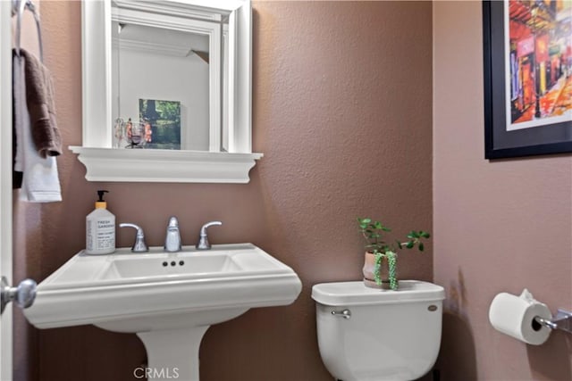 12531 Cluster Pines Rd, Garden Grove, CA 92845 - half bath with toilet, a sink, and a textured wall