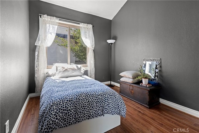 12531 Cluster Pines Rd, Garden Grove, CA 92845 - bedroom with wood finished floors, baseboards, vaulted ceiling, and a textured wall