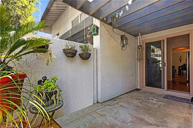 12531 Cluster Pines Rd, Garden Grove, CA 92845 - property entrance with stucco siding and a patio