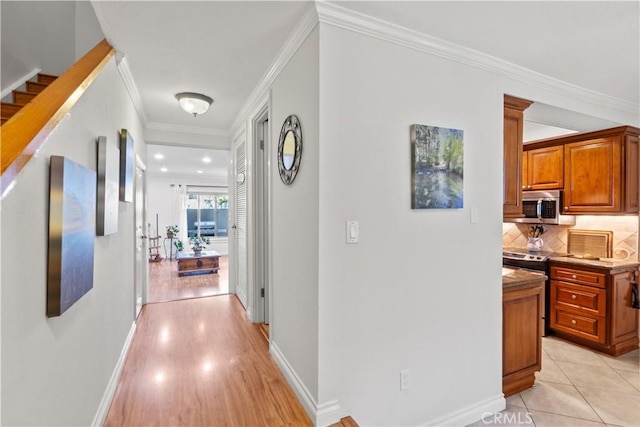 12531 Cluster Pines Rd, Garden Grove, CA 92845 - hall with crown molding, light wood-style flooring, and baseboards