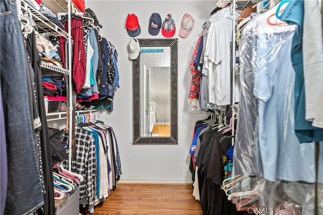 12531 Cluster Pines Rd, Garden Grove, CA 92845 - walk in closet featuring wood finished floors
