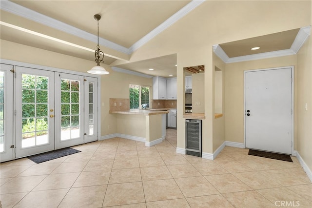 1725 Aspen Village Way, West Covina, CA 91791 - kitchen with wine cooler, crown molding, light countertops, a peninsula, and french doors