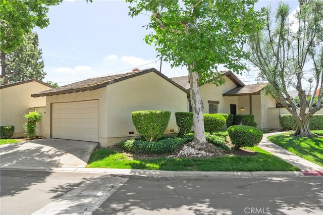 1725 Aspen Village Way, West Covina, CA 91791 - view of front facade with concrete driveway and stucco siding