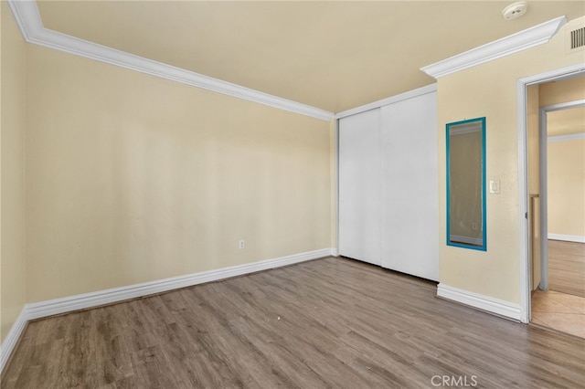 1725 Aspen Village Way, West Covina, CA 91791 - spare room featuring crown molding, a smoke detector, wood finished floors, and baseboards