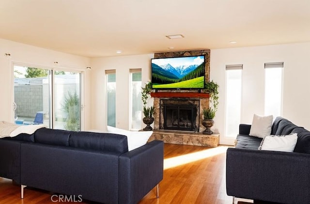 4865 Orchard St, Montclair, CA 91763 - living area featuring a fireplace and wood finished floors