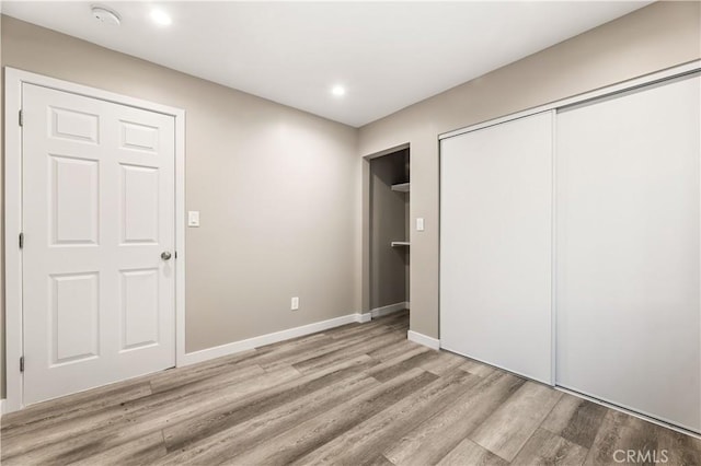 13250 Mercer St, Pacoima, CA 91331 - unfurnished bedroom with wood finished floors, a closet, recessed lighting, and baseboards