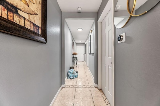 13250 Mercer St, Pacoima, CA 91331 - hallway with light tile patterned floors, baseboards, and a textured wall
