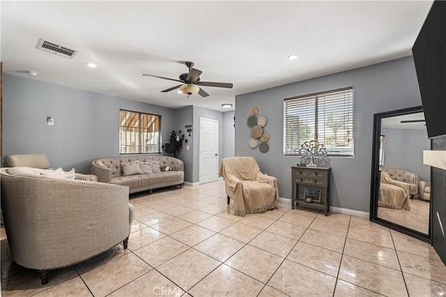 13250 Mercer St, Pacoima, CA 91331 - living area with ceiling fan, light tile patterned floors, baseboards, recessed lighting, and a fireplace
