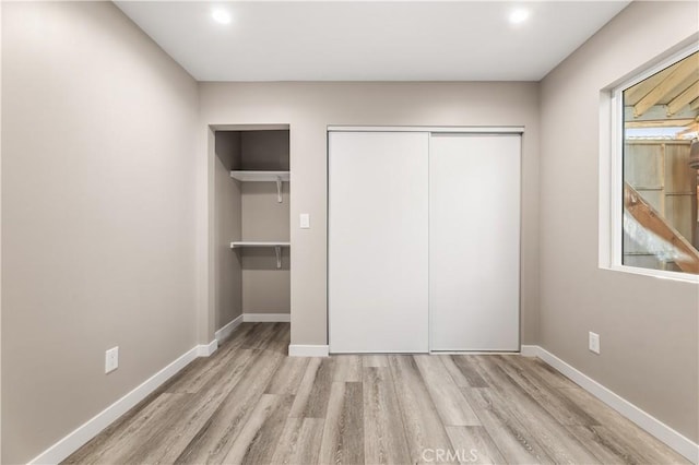 13250 Mercer St, Pacoima, CA 91331 - unfurnished bedroom with wood finished floors, a closet, baseboards, and recessed lighting