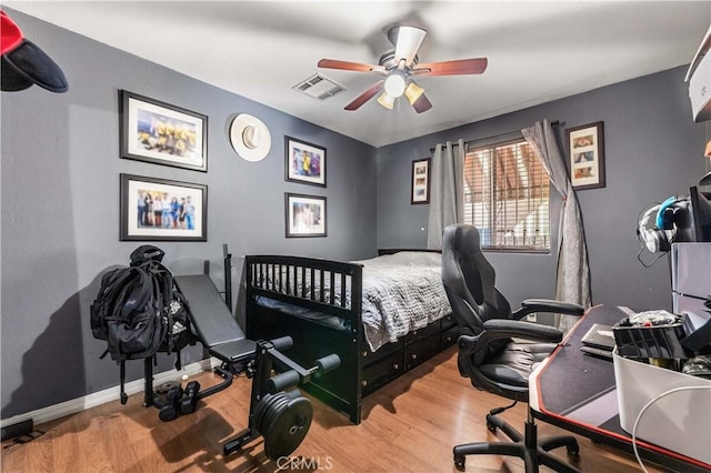 13250 Mercer St, Pacoima, CA 91331 - bedroom featuring wood finished floors, an office area, and ceiling fan