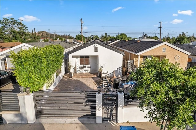 13250 Mercer St, Pacoima, CA 91331 - view of front of property with a fenced front yard, a gate, and stucco siding