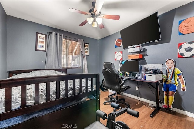 13250 Mercer St, Pacoima, CA 91331 - bedroom with wood finished floors, baseboards, a desk, and ceiling fan