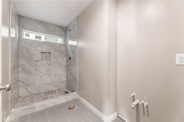 13250 Mercer St, Pacoima, CA 91331 - full bathroom featuring tiled shower, baseboards, and tile patterned floors