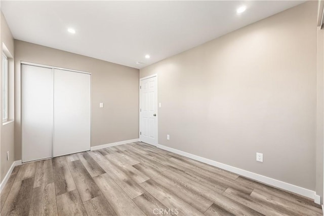 13250 Mercer St, Pacoima, CA 91331 - unfurnished bedroom with light wood-type flooring, baseboards, a closet, and recessed lighting