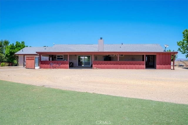 5498 Forked Horn Pl, Paso Robles, CA 93446 - view of front facade featuring a chimney, a garage, and driveway
