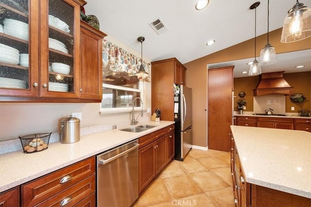 5498 Forked Horn Pl, Paso Robles, CA 93446 - kitchen featuring stainless steel appliances, a sink, premium range hood, lofted ceiling, and brown cabinets
