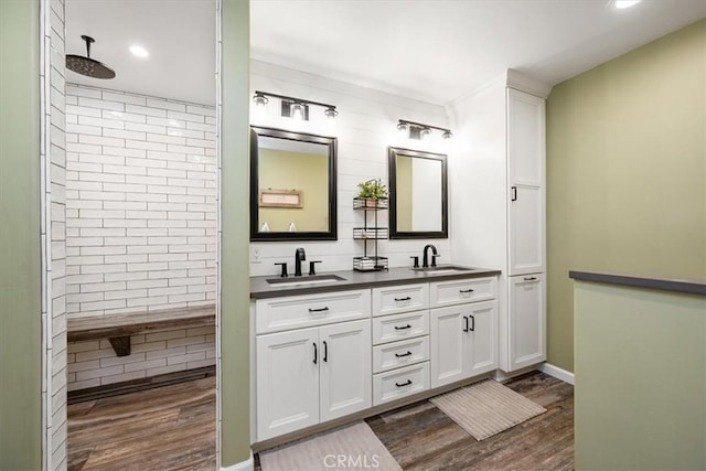 5498 Forked Horn Pl, Paso Robles, CA 93446 - full bath featuring wood finished floors, double vanity, a tile shower, recessed lighting, and baseboards