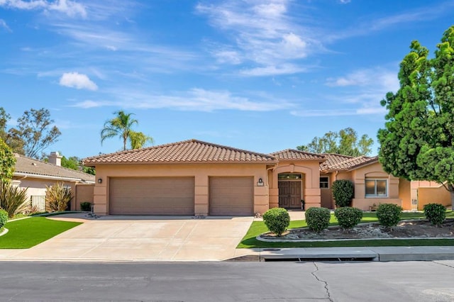 3325 Avenida Magoria, Escondido, CA 92029 - mediterranean / spanish house with stucco siding, an attached garage, a tile roof, and concrete driveway